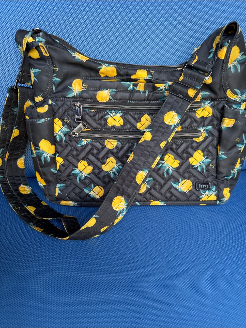 Lug Camper SE Crossbody Bag in the Citrus Black pattern. Lemon print